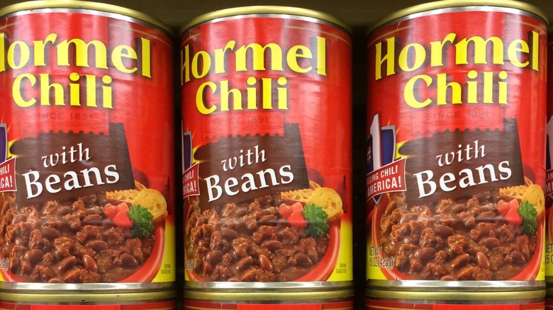 Cans of Hormel Chili stacked