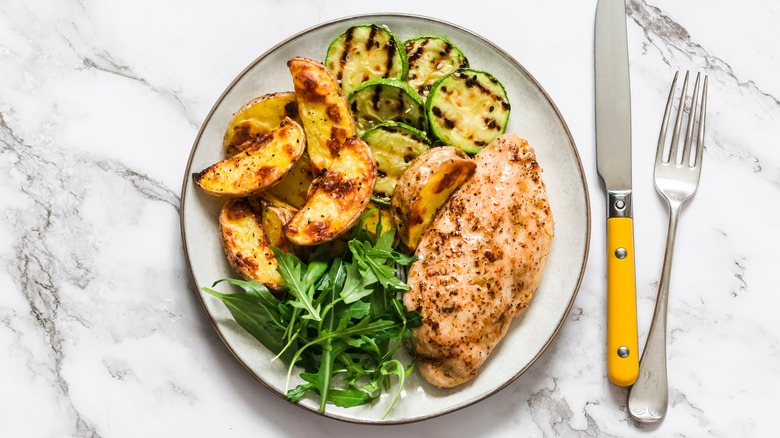 Chicken and vegetables on plate