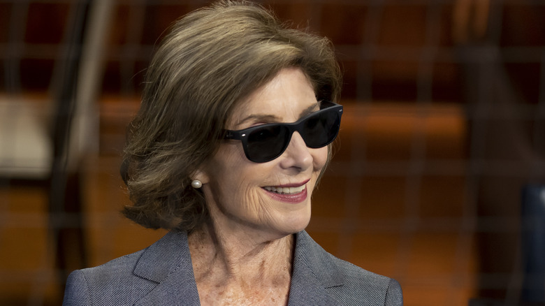 Laura Bush smiling and wearing sunglasses