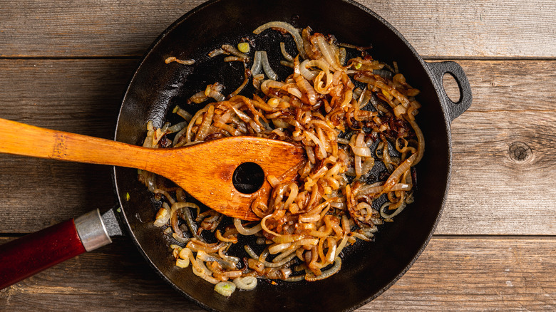 A pan filled with caramelized onions