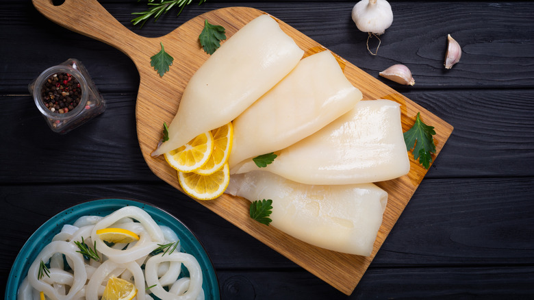 uncooked squid on cutting board