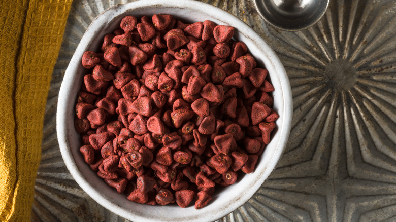 Achiote seeds in a bowl