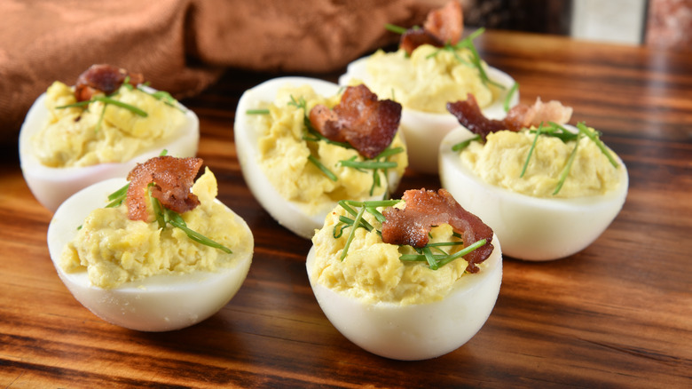 Deviled eggs topped with bacon 