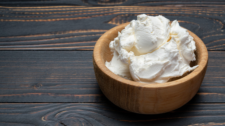 Wooden bowl of mascarpone cheese