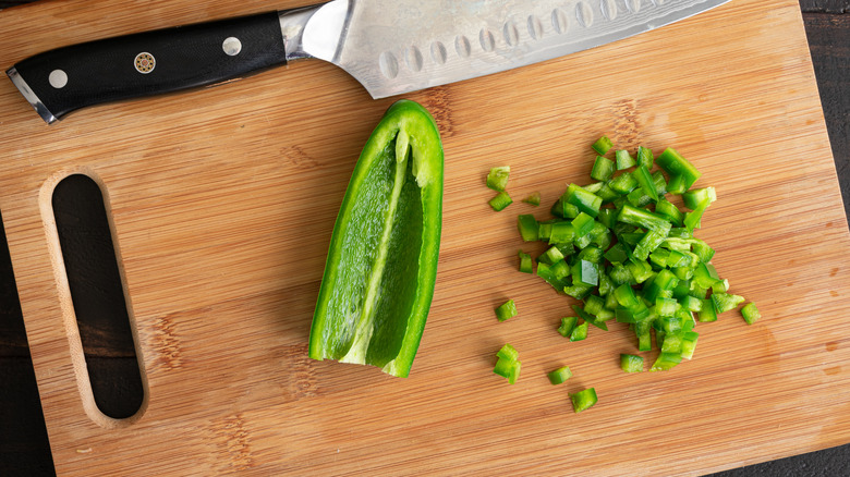 Minced jalapeños on chopping board