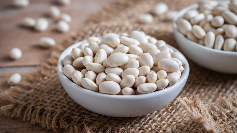 uncooked white beans in bowl