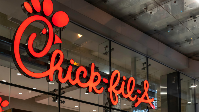 Chick-fil-A neon logo on window