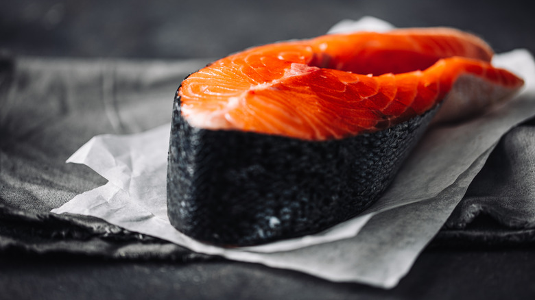 Raw Salmon atop parchment paper