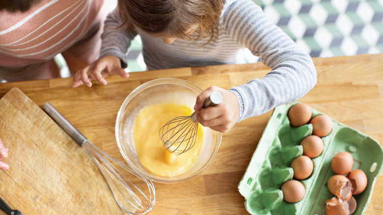 whisking eggs in a bowl