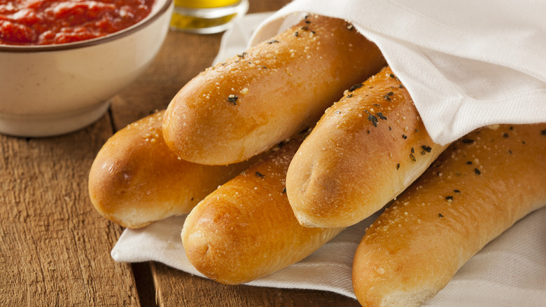 breadsticks wrapped in white cloth