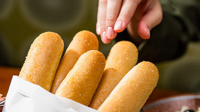 reaching for olive garden breadsticks