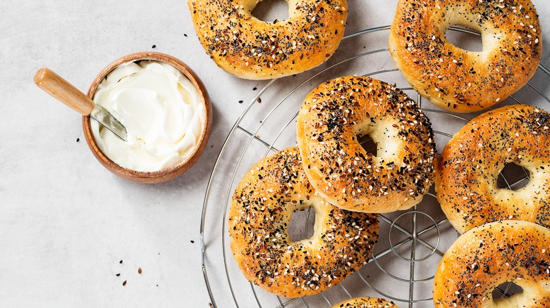 several bagels and cream cheese