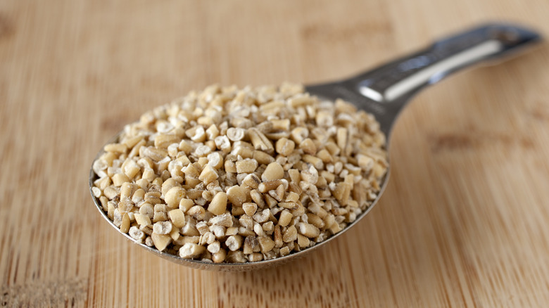 steel-cut oats in metal spoon