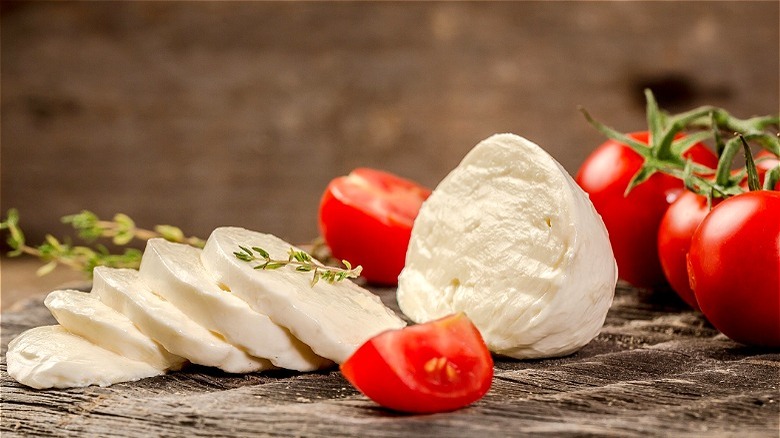 Slices of fresh mozzarella with tomatoes 