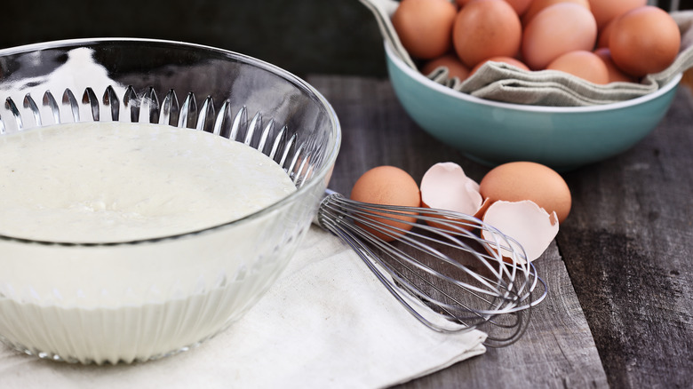 Waffle batter with eggs and whisk