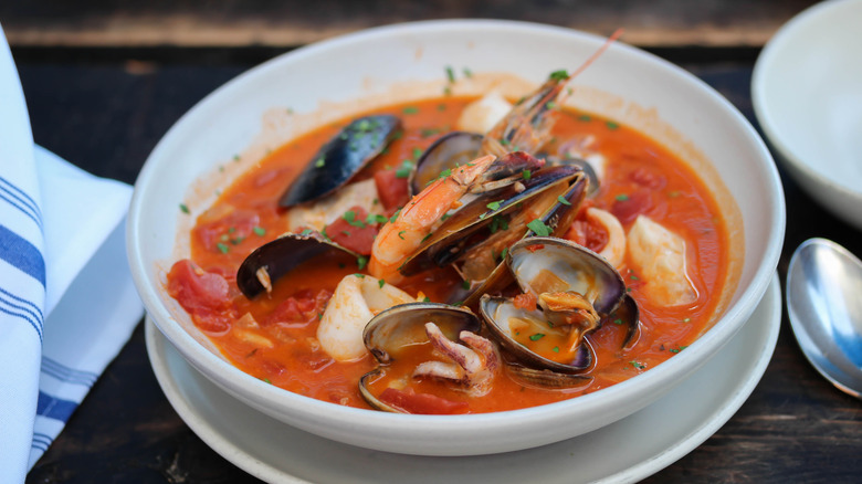 A bowl of rustic seafood soup