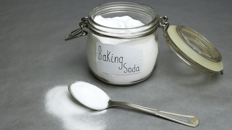 Baking soda in jar with spoon