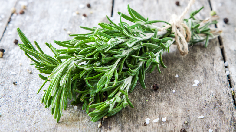 Fresh rosemary on wood board