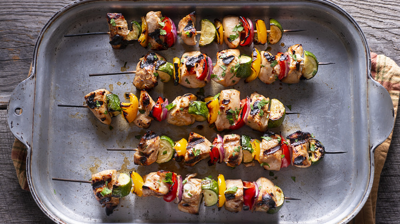 Chopped chicken on skewers