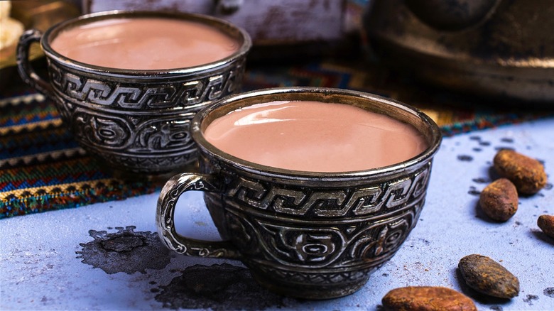 Hot chocolate coffee in silver mugs