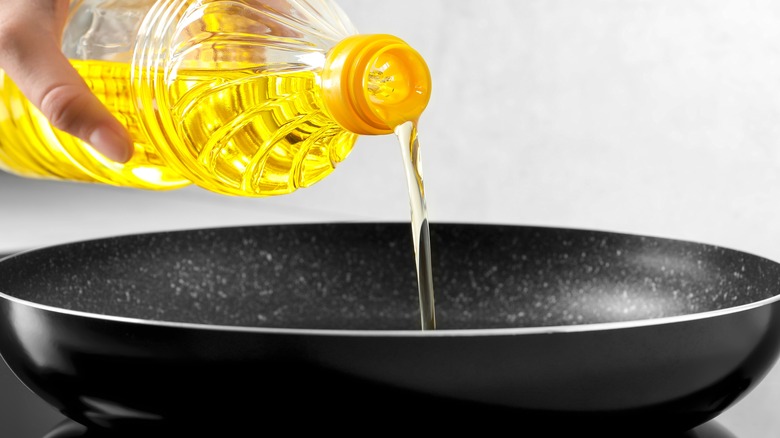 Pouring cooking oil