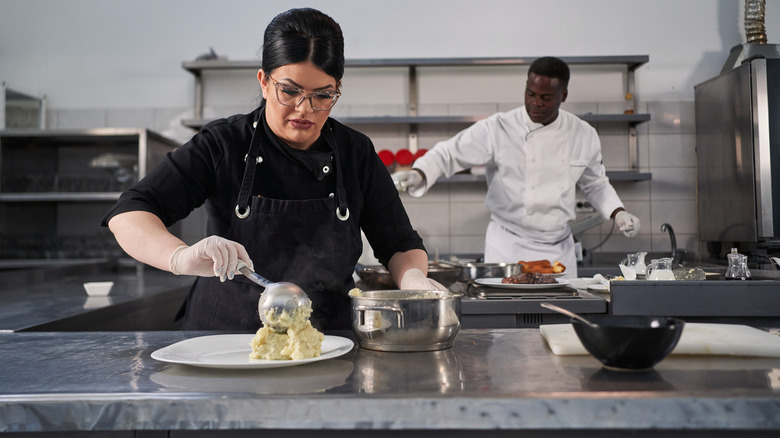 Chef plating mashed potatoes