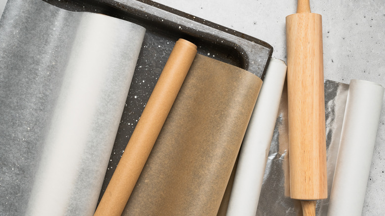 rolling pin and wax paper parchment paper plastic wrap