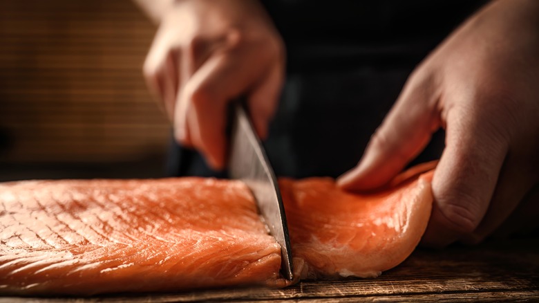 Cutting salmon filets with a knife