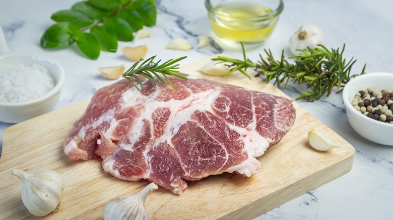 Raw pork tenderloin with rosemary