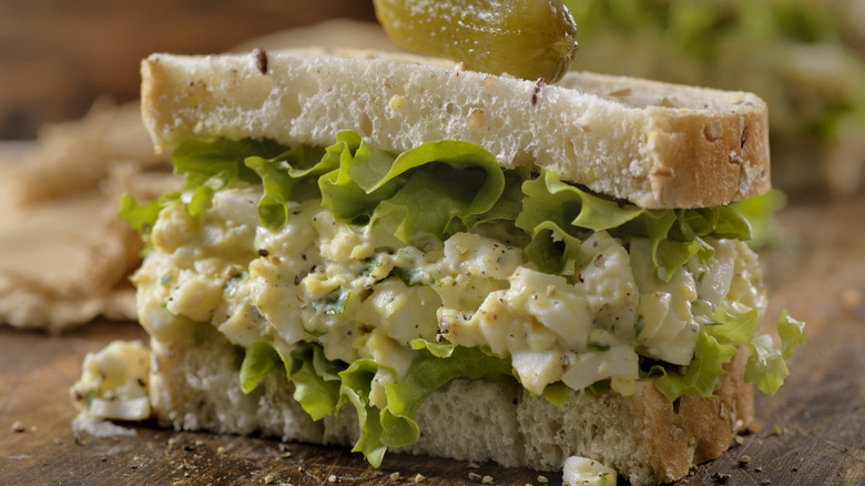 Egg salad sandwich on white bread with lettuce