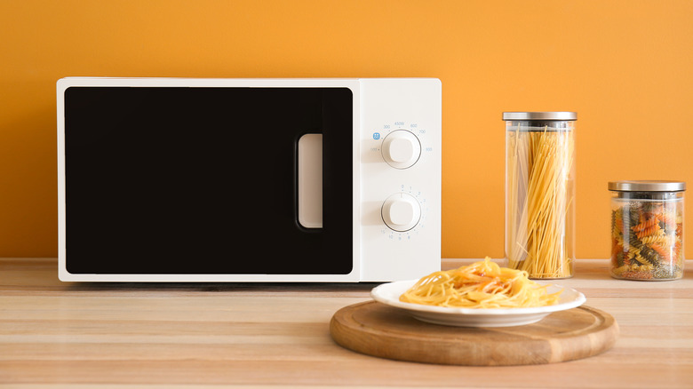 plate of pasta and microwave