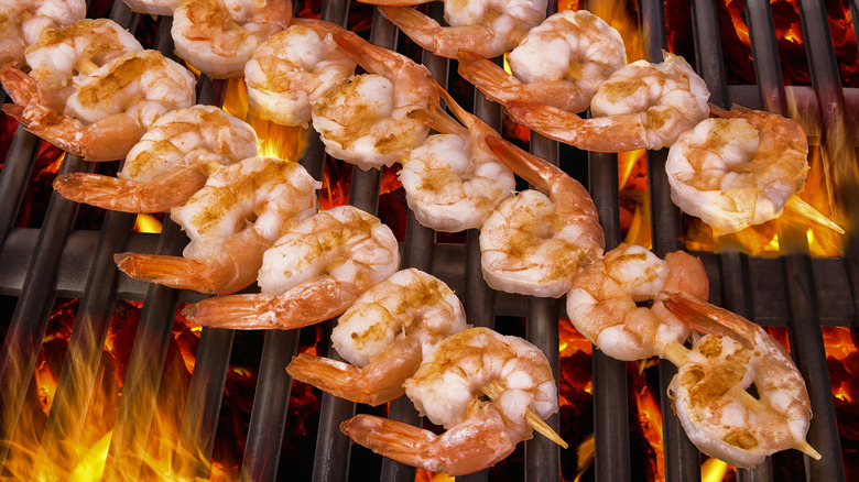 shrimp on skewers on grill