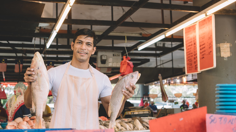 fishmonger at market