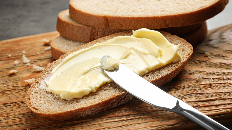 Bread with butter and silver knife