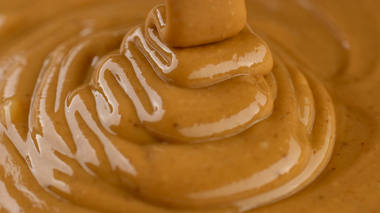 A close up of melted peanut butter