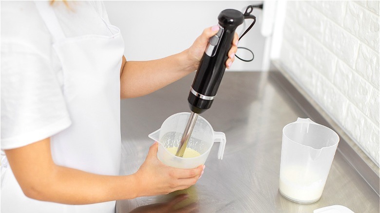 Immersion blender in cream