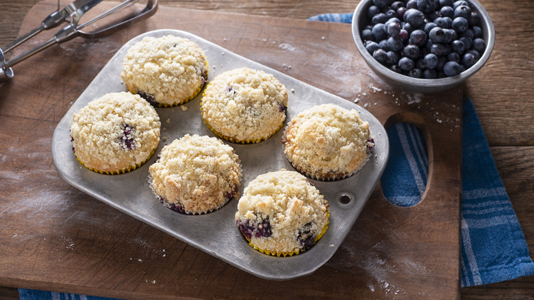 blueberry streusel muffins in tray