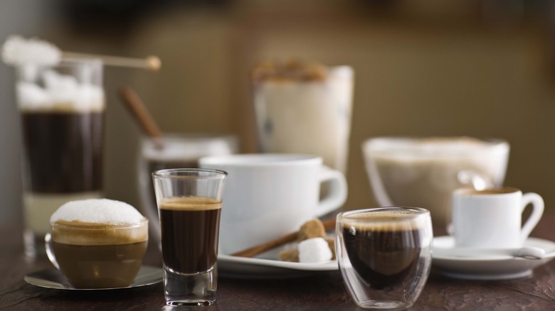 shots of espresso and lattes on a table