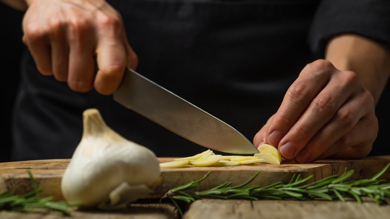 Chef chopping garlic