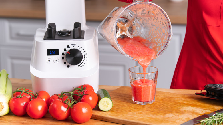 blended tomato juice poured from blender