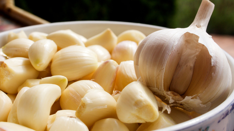 peeled garlic cloves in bowl