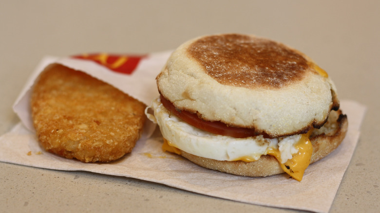 Egg McMuffin and hash brown on napkin