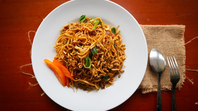 Noodle dish with fork and spoon