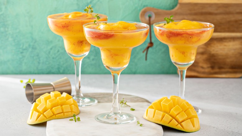 Three frozen mango margaritas