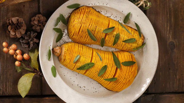 Roasted squash on plate with herbs