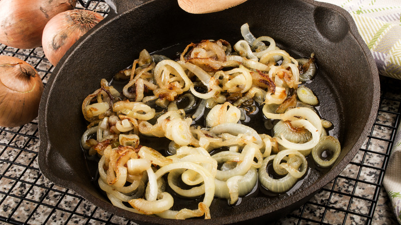 onions cooking in cast iron pan