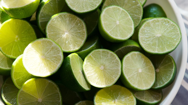 Half-sliced limes in basket