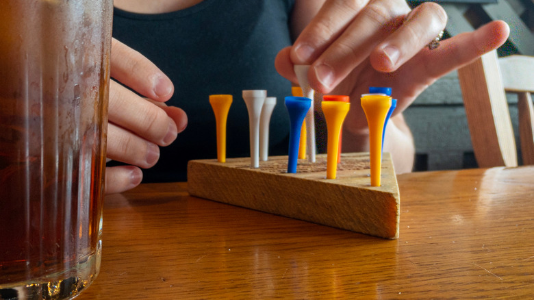 close up of woman playing the Peg Game