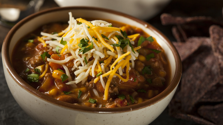 bowl of chili topped with cheese