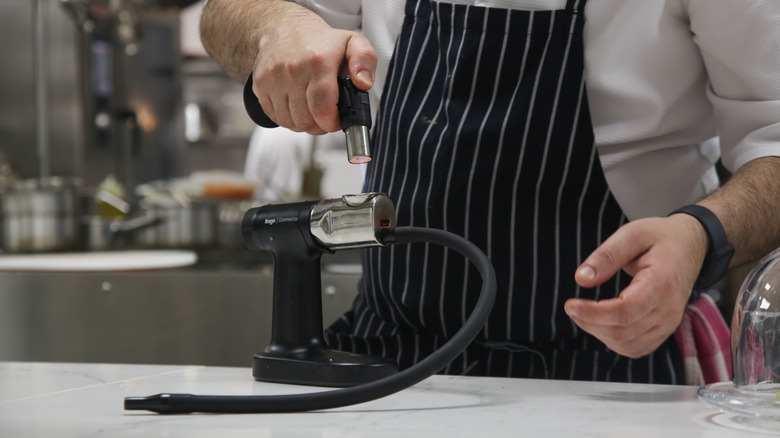 chef using a smoking gun